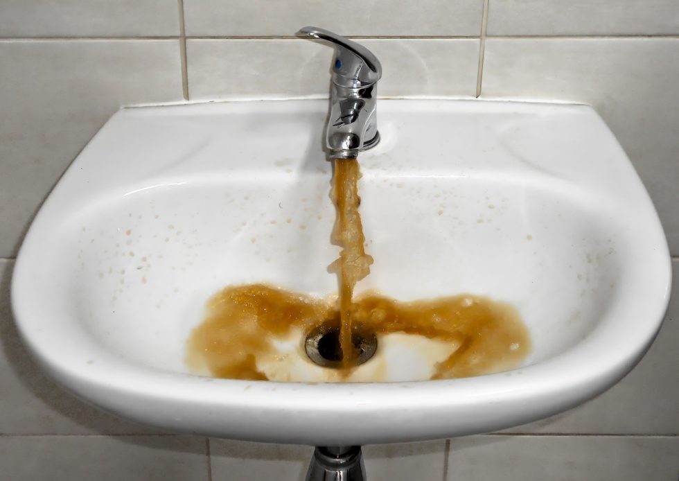 bathroom sink backing up with dirty water